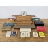 A group of vintage games, including cribbage boards, cards & dominoes