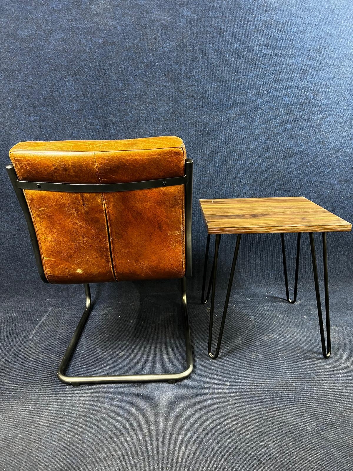 A modern leather and chrome cantilevered chair, and a side table on hairpin supports. Table H.56 W. - Image 2 of 4