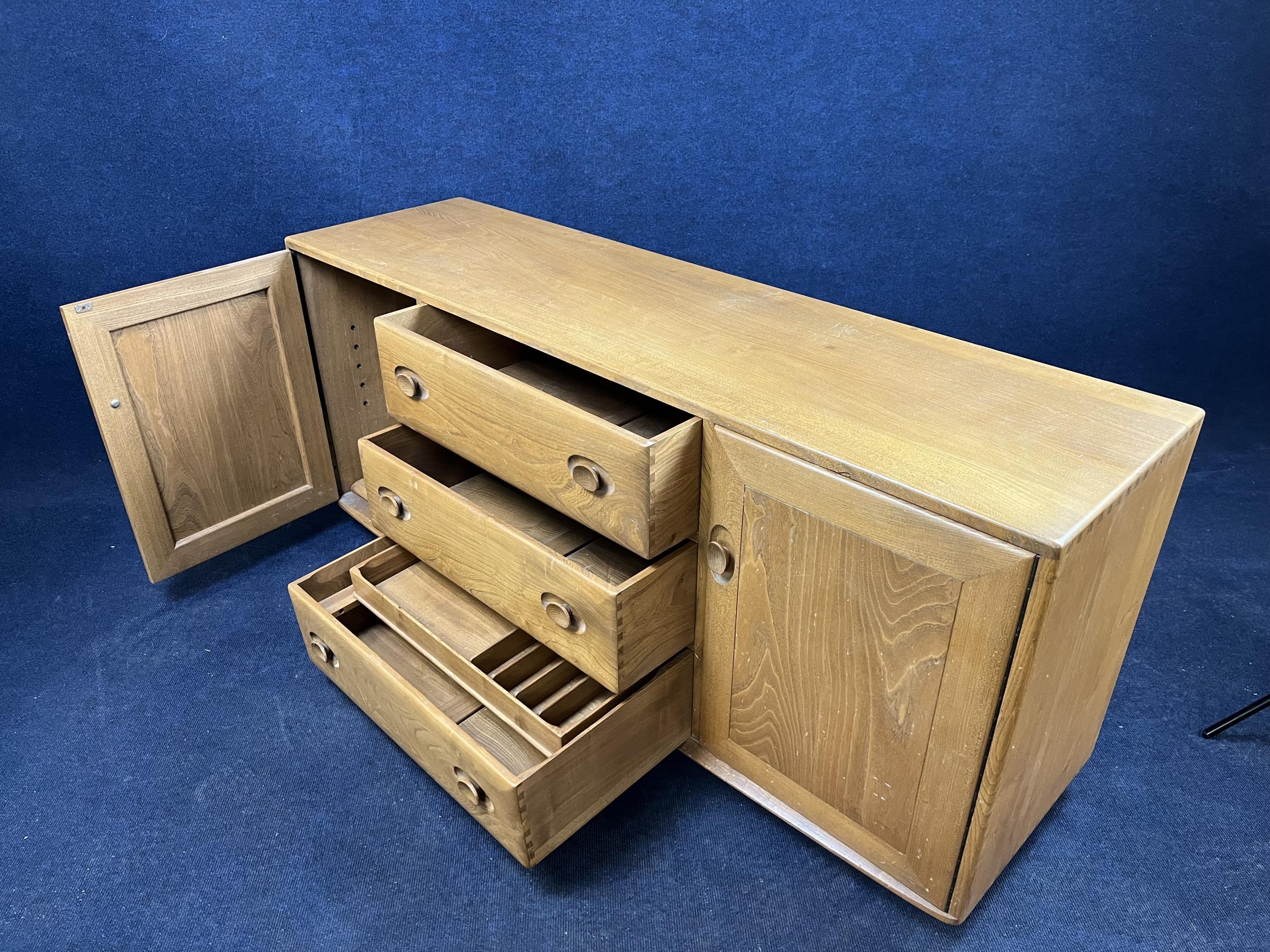 An Ercol elm sideboard. H.70 W.157 D.44.cm - Image 5 of 5