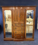 A mahogany and mirrored, break bow front wardrobe, 20th century. H.210 W.186 D.60.cm