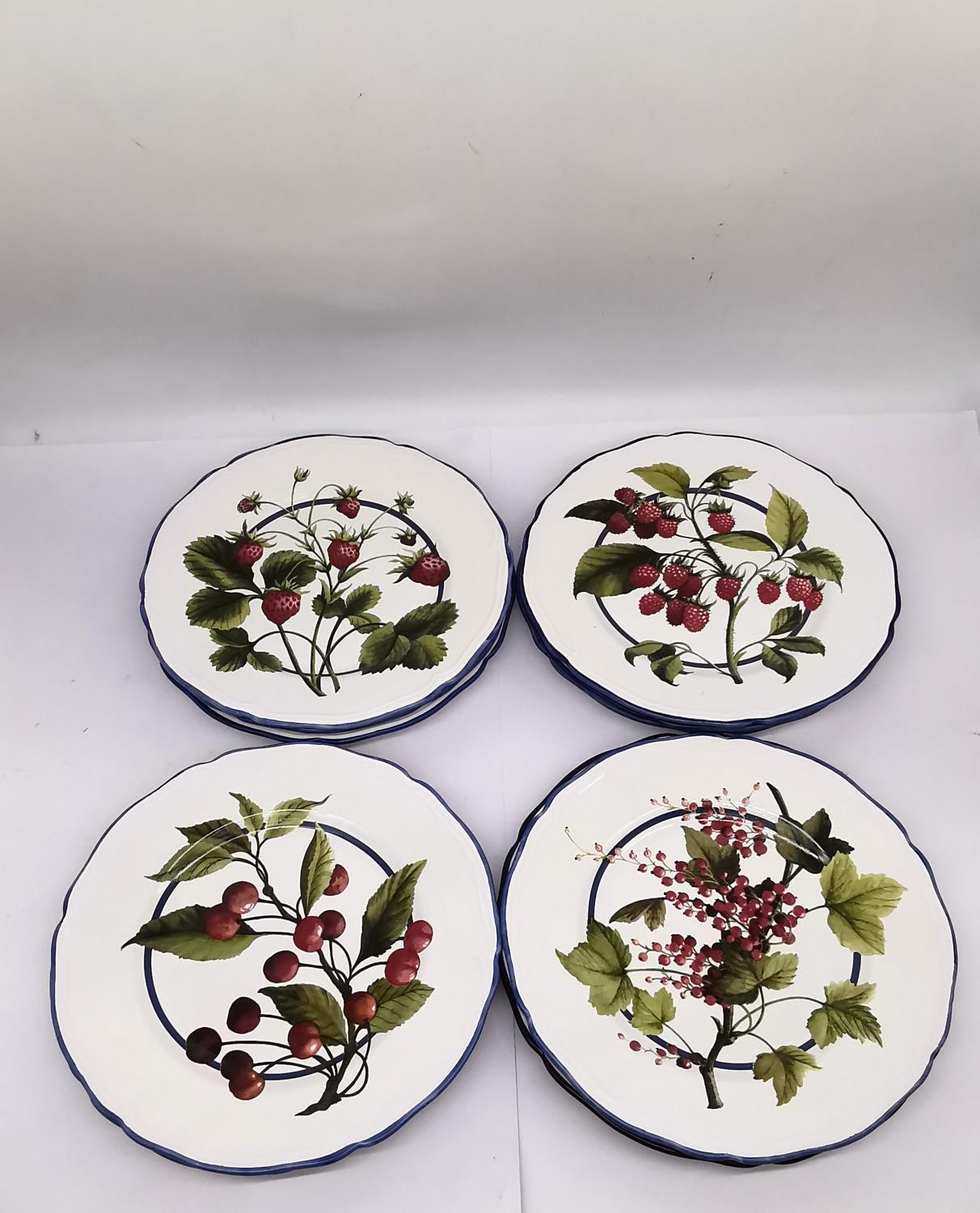 A set of ten dinner plates by 'Colefax and Fowler' with fruit design. (3 x raspberry, 3 x