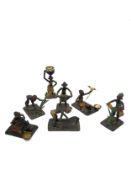 Seven miniature African tribal painted metal figures depicting various everyday activities.