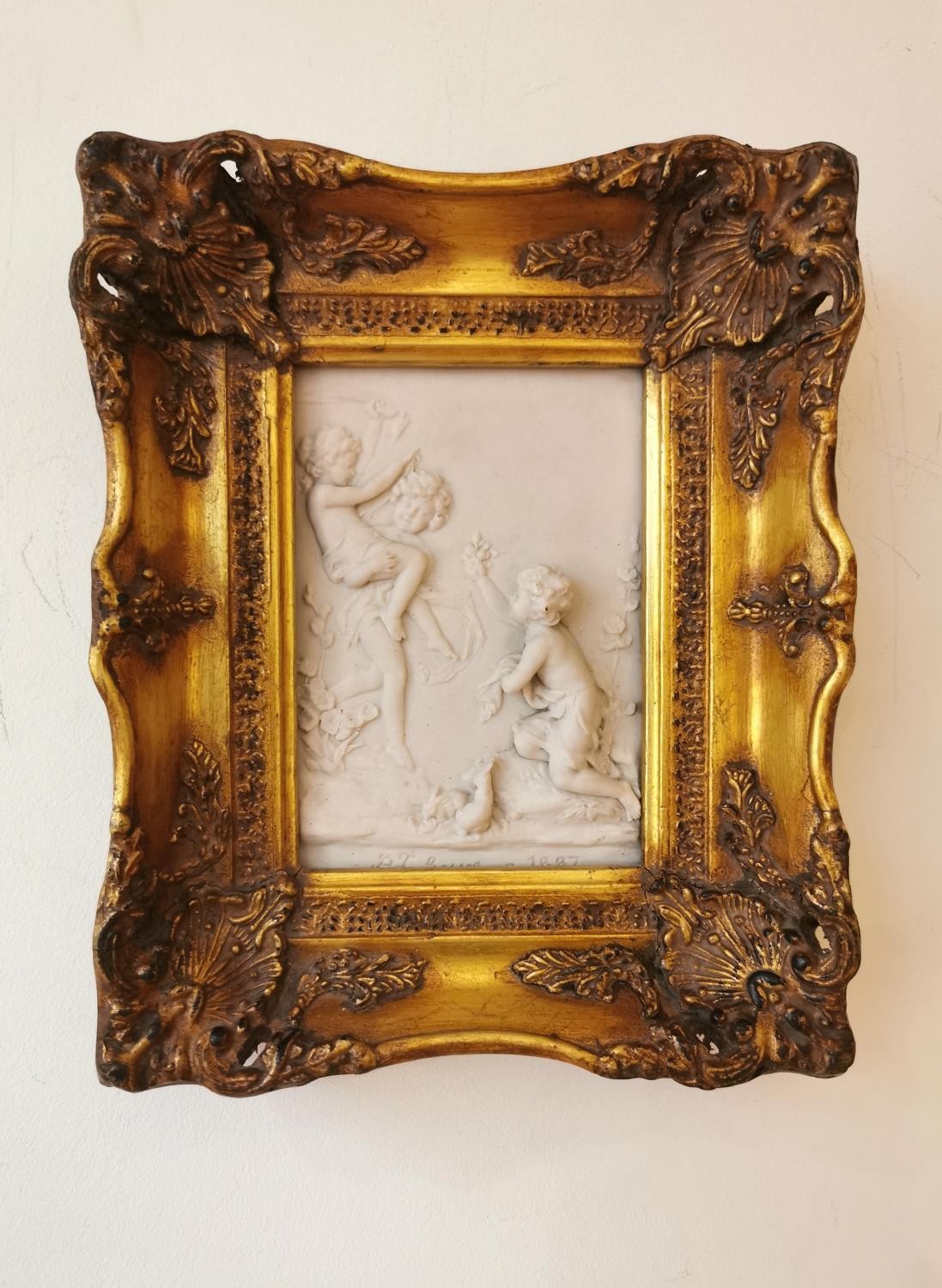 A moulded gold framed composite marble relief plaque of putti by 'P J Seymour', with bronze medal - Image 2 of 9