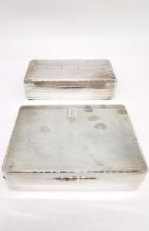 Two silver cedar lined cigarette boxes, one by William Neale with engraved monogram and geometric