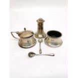 A silver cruet set with engine turned detailing by J Collyer & Co Ltd, including pepper shaker,