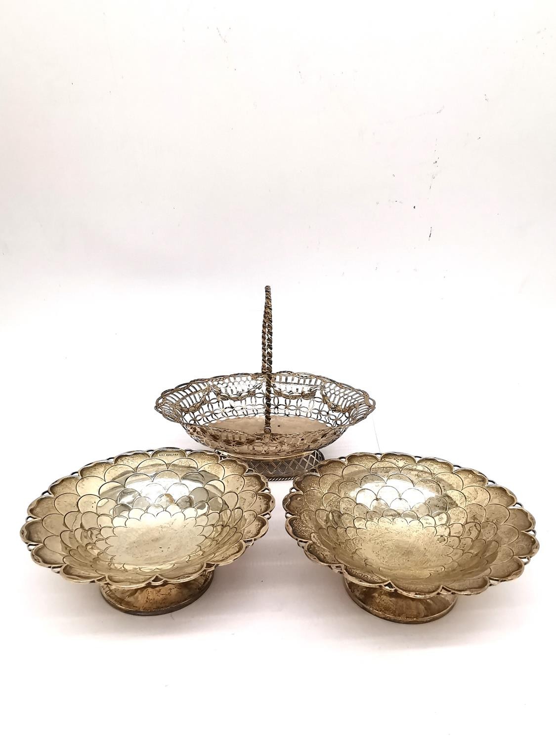 A pair of silver Mappin and Webb floral design bon bon dishes along with a Georgian silver pierced