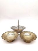 A pair of silver Mappin and Webb floral design bon bon dishes along with a Georgian silver pierced