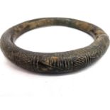 An ancient Iranian bronze torque arm bracelet/necklace with incised design. Diameter 12cm,