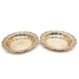 A pair of Art Deco Asprey silver dishes with engraved foliate design to the borders. Hallmarked:A&