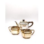 An Art Deco three piece silver tea set by Roberts & Belk, consisting of a teapot, twin handled sugar