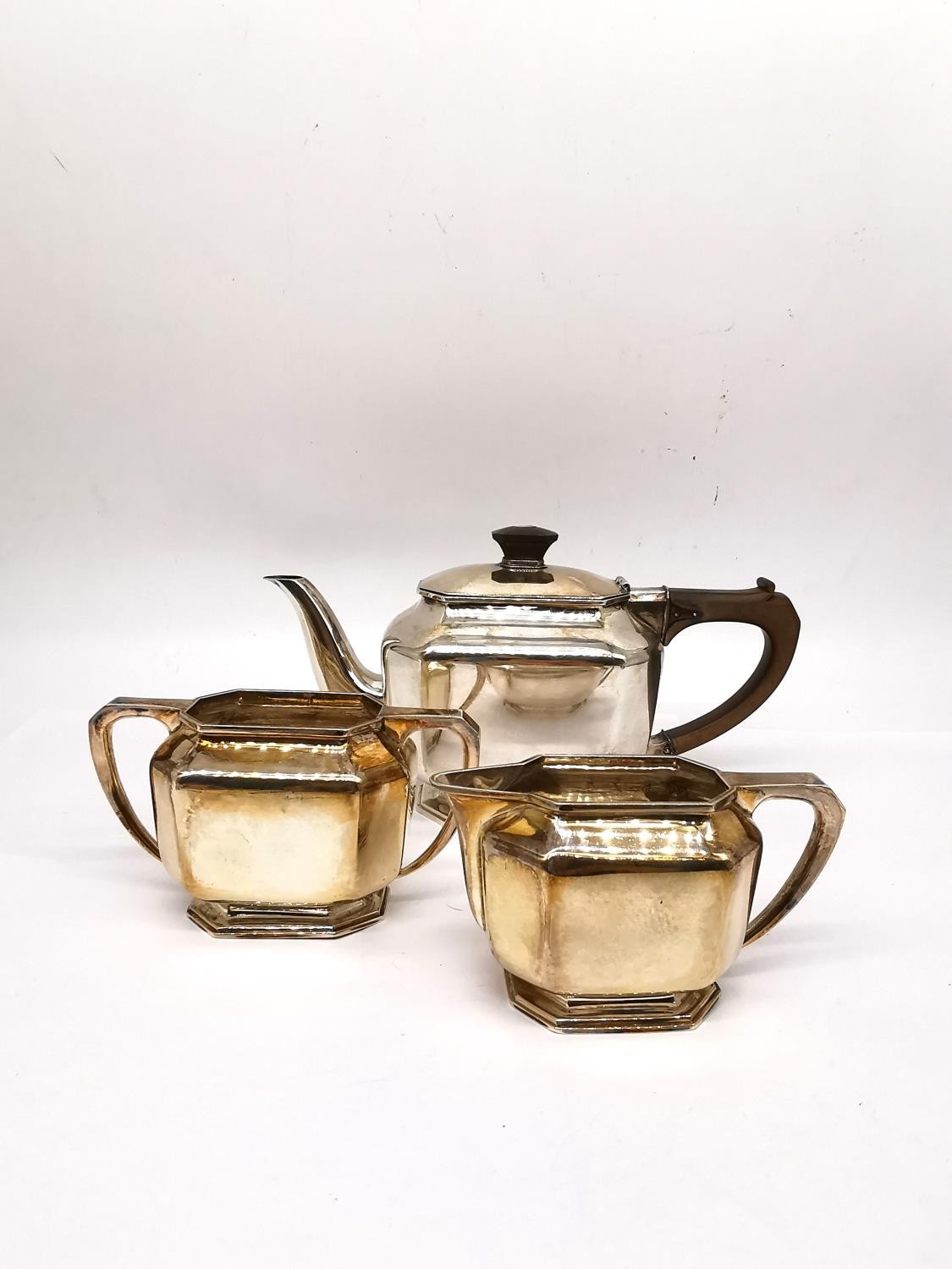 An Art Deco three piece silver tea set by Roberts & Belk, consisting of a teapot, twin handled sugar - Image 2 of 9