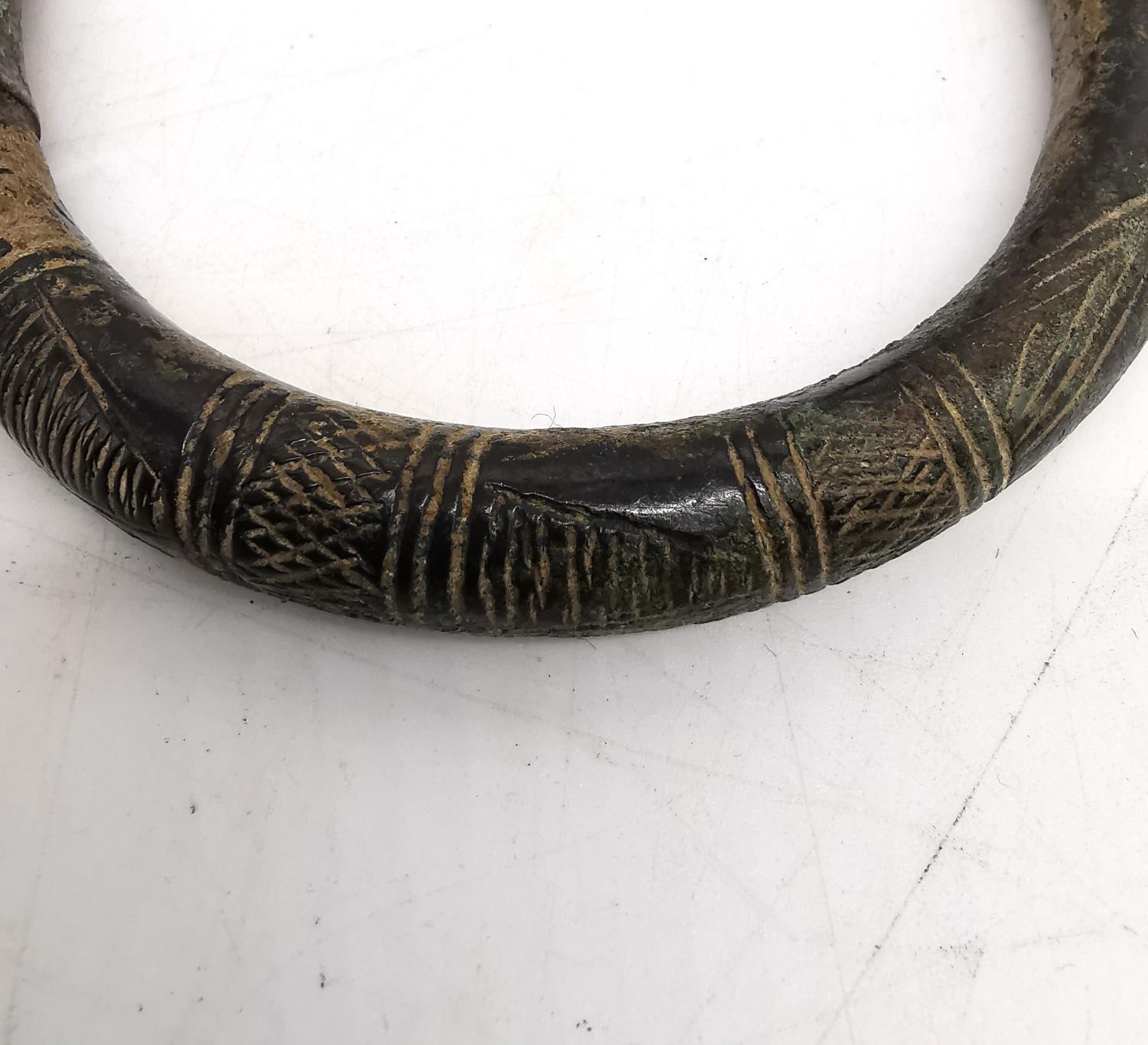 An ancient Iranian bronze torque arm bracelet/necklace with incised design. Diameter 12cm, - Image 5 of 6
