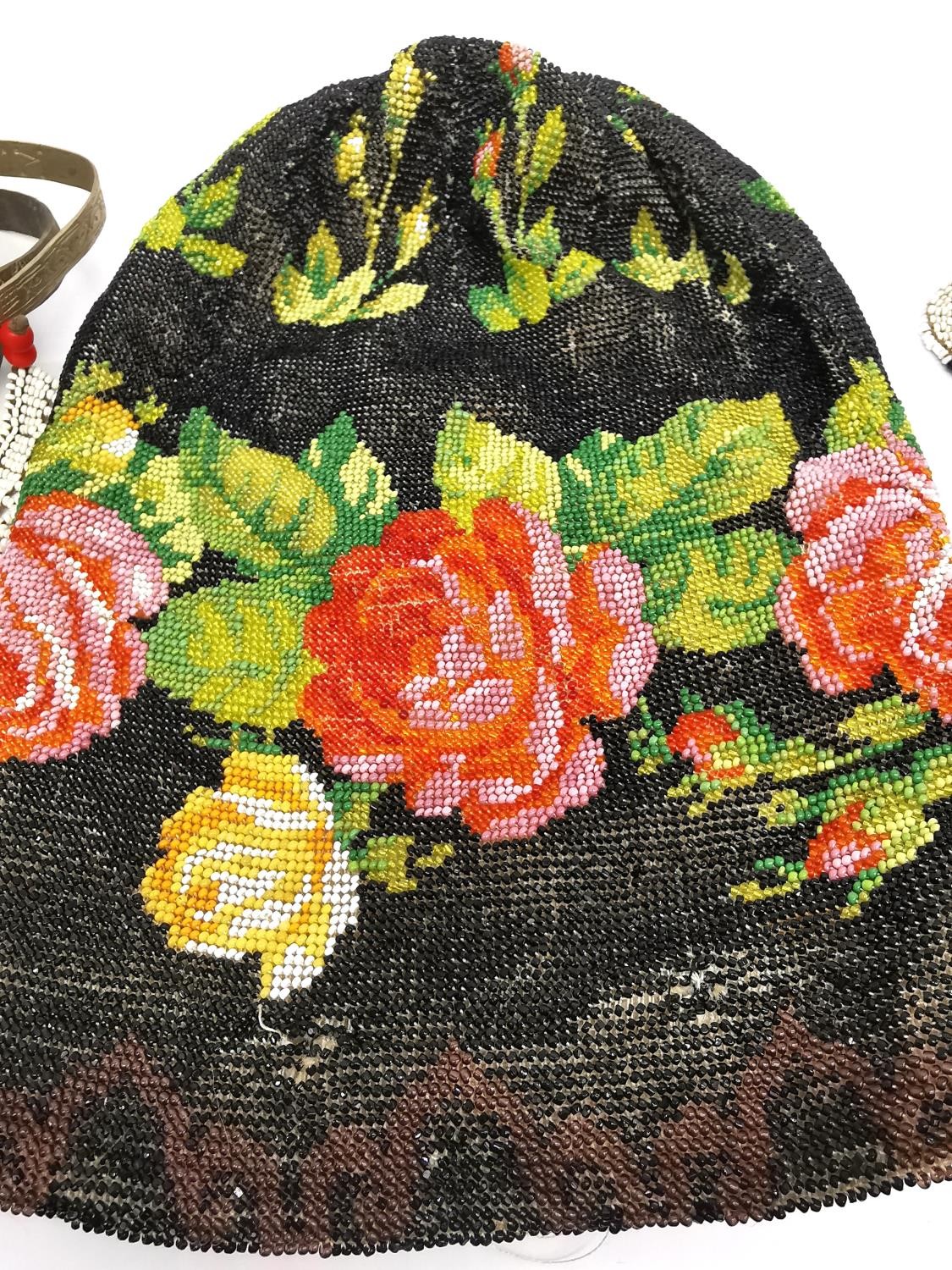 An early 20th century beaded rose design silk lined evening bag and a coin pouch with steel cut - Image 2 of 3
