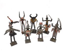 Eight vintage Akan Ashanti painted metal tribal figures of musicians. Tallest 17cm.