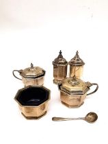 A silver five piece cruet set by Mappin & Webb, to include two mustard pots with blue glass