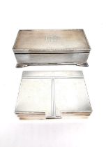 Two Art Deco engine turn decorated cedar lined silver cigarette boxes. One with engraved geometric