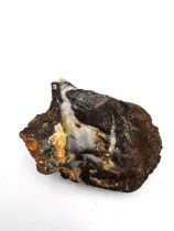 An Australian, Adelaide 1986, rough boulder opal specimen L.4.5 W.3.3 H.2cm. Weight 29.80g