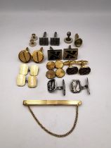 A collection of seven pairs of cufflinks, one of which 9ct on silver with engine turned