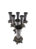 A set of seven WMF silver plated Art Nouveau stylised floral design table candle holders. Numbered