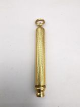 An early 20th century engine turned design Sampson and Morden 18ct gold extending pencil. Hallmarked