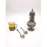 A collection of silver, including a repousse silver sugar sifter with scrolling foliate design,