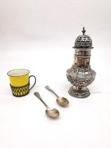 A collection of silver, including a repousse silver sugar sifter with scrolling foliate design,