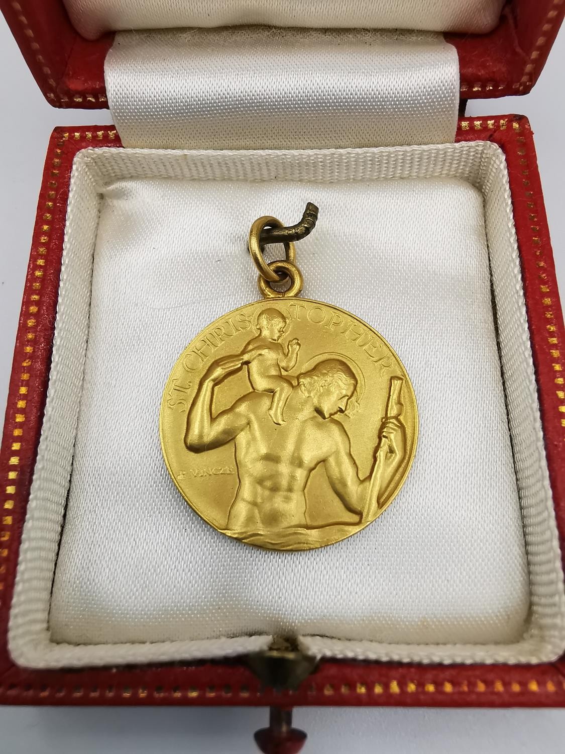 A leather boxed 9ct yellow gold St. Christopher medallion by Paul Vincze. Medallion signed P.