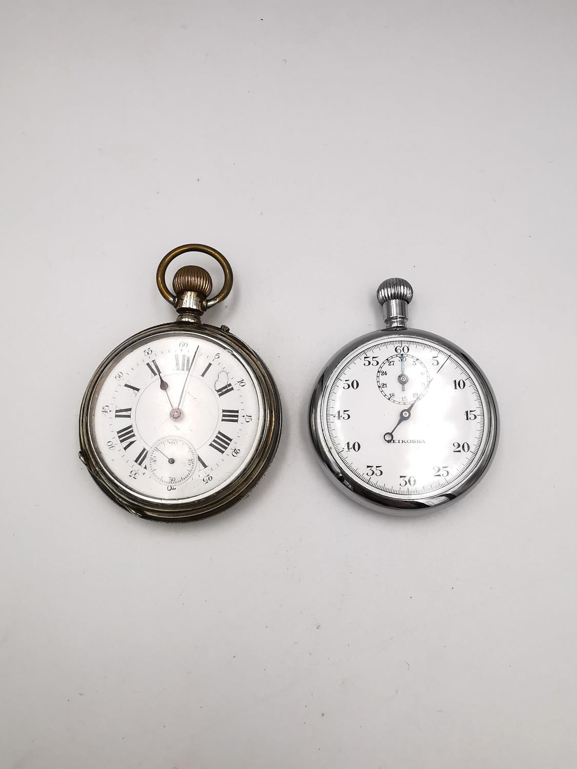 A Victorian white metal Remontoir 10 rubis pocket watch with white enamel dial and black roman