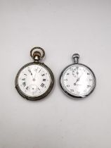 A Victorian white metal Remontoir 10 rubis pocket watch with white enamel dial and black roman