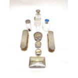 A glass dressing table set with silver tops, to include jars, a perfume bottle with enamelled cap
