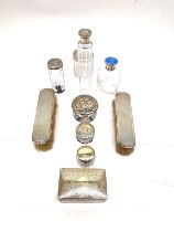A glass dressing table set with silver tops, to include jars, a perfume bottle with enamelled cap