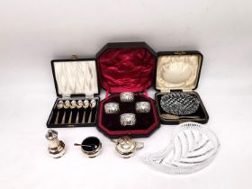 A collection of silver, including a silver cruet set, a leather cased set of four salts by Sibray,