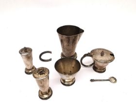 A white metal middle eastern cruet set, comprising a hinged mustard pot with spoon, sugar bowl,