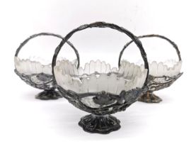A collection of three silver plated sculptural vine and grape design sugar bowls with frosted cut