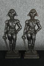 A pair of vintage cast iron door stops, in the form of naval figures, possibly Napoleon. H.36cm. (