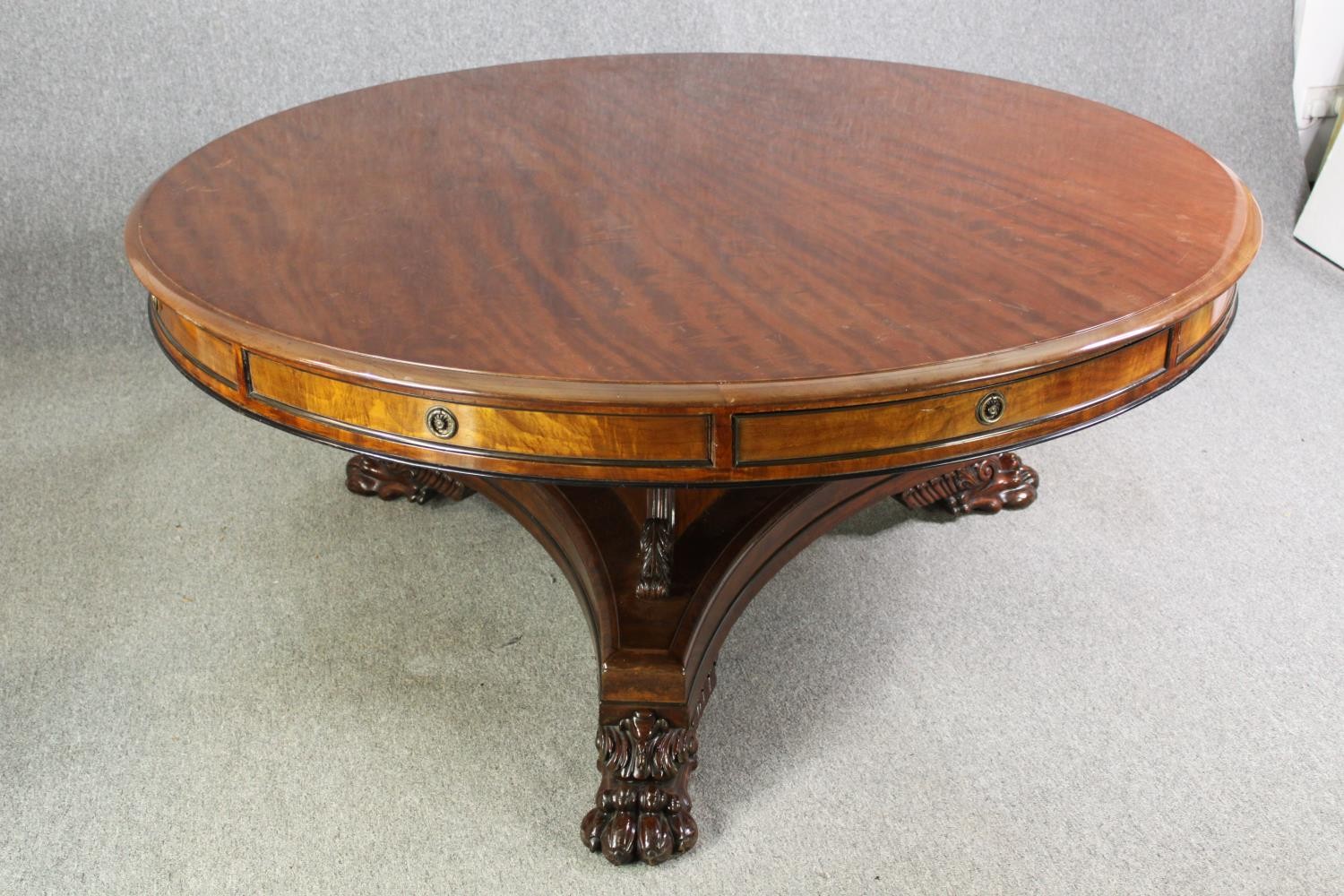 A late Regency style mahogany drum top dining or centre table, bearing a Waring & Gillows - Image 6 of 16