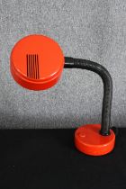 A vintage 1970's Hanimex red plastic reading lamp. H.61cm.