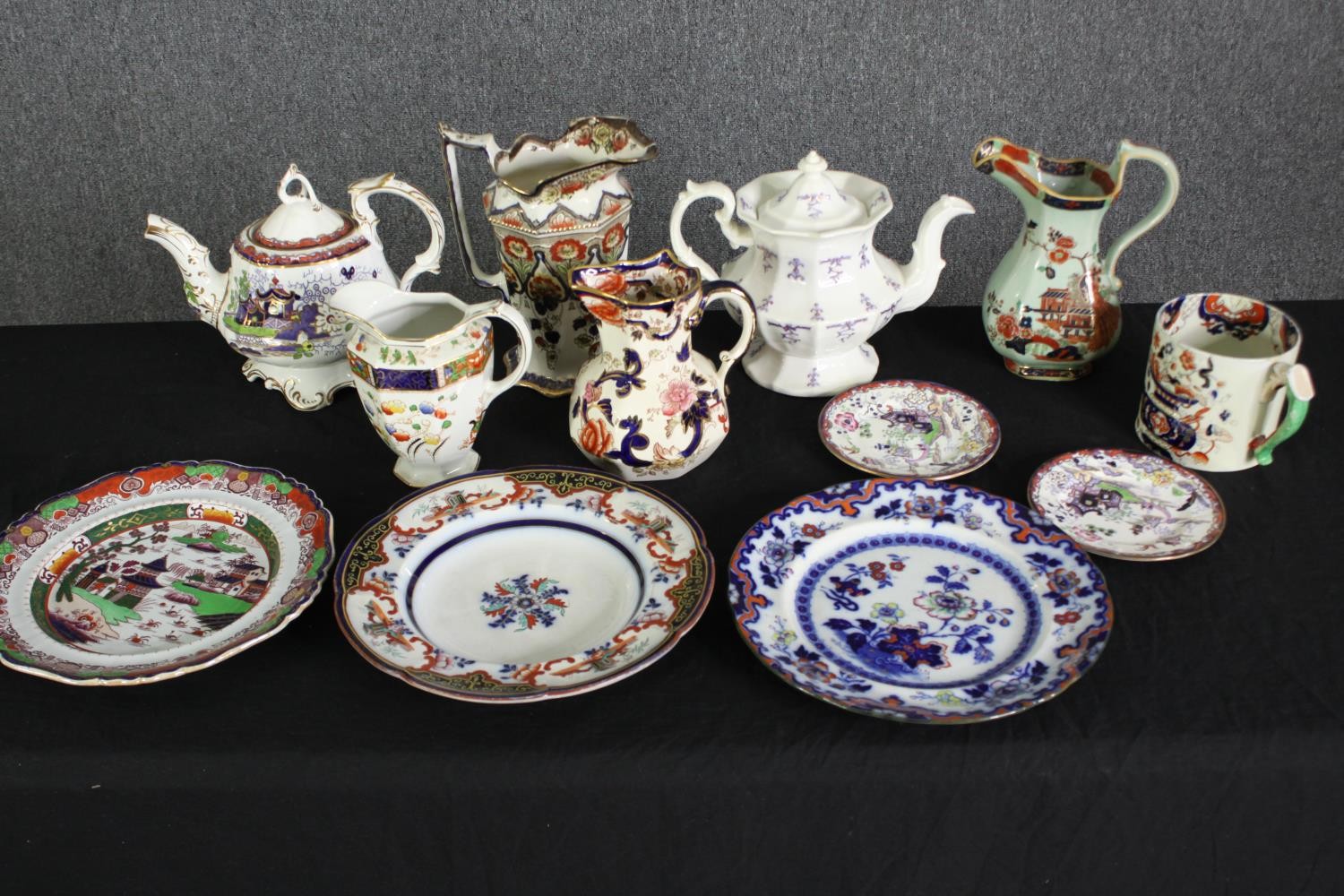 A group of various Staffordshire porcelain tea pots, jugs and plates. H.21cm. (largest).