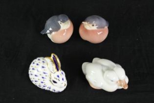 A group of four Royal Copenhagen porcelain birds and a rabbit. L.10cm. (largest).