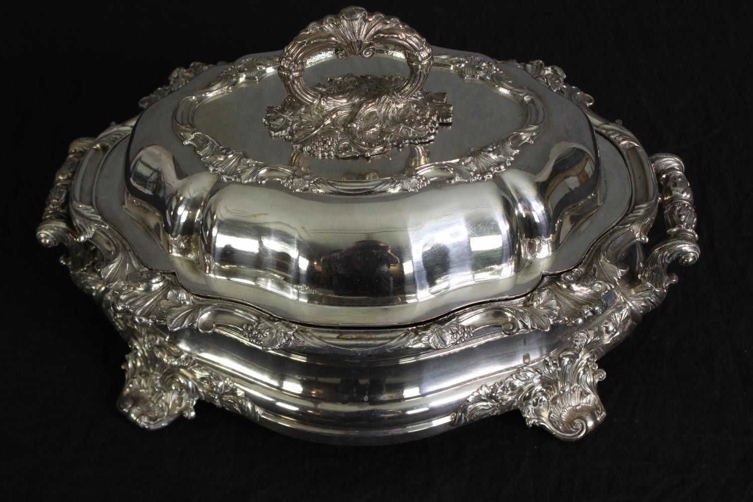 A silver plated entree dish. H.18 W.36 W.26cm.