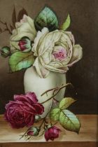 Still life composition of roses, painted glass, within a giltwood frame. H.38 W.32cm.