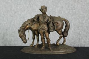 A spelter group of a man and horse. H.19cm.