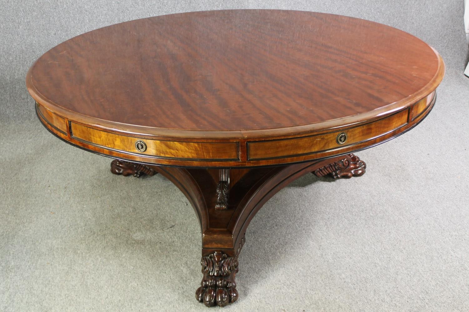 A late Regency style mahogany drum top dining or centre table, bearing a Waring & Gillows - Image 3 of 16