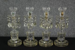 A set of four cut glass lustres, 19th century. H.39cm. (each).