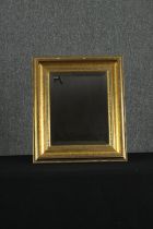 A giltwood wall mirror. H.50 W.42cm.