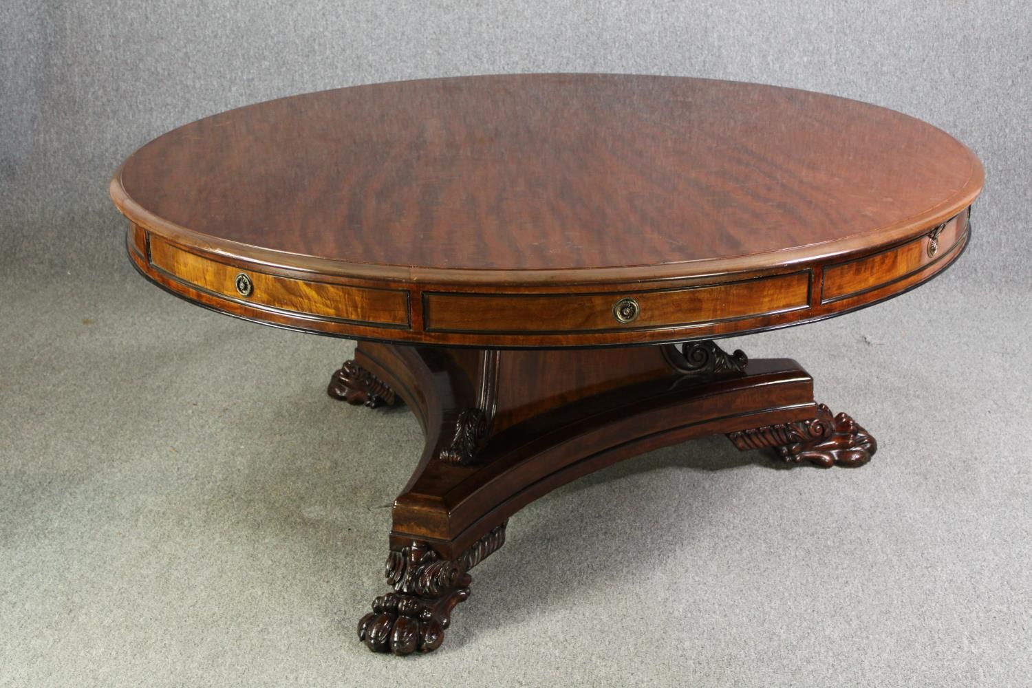 A late Regency style mahogany drum top dining or centre table, bearing a Waring & Gillows - Image 2 of 16