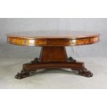 A late Regency style mahogany drum top dining or centre table, bearing a Waring & Gillows