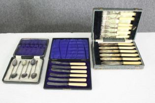 A group of three cased silver plated sets of cutlery, including cake knives, fish knives and