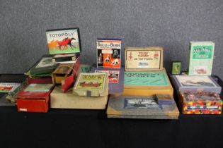 A collection of vintage puzzles and games, Totopoly etc. H.9 W.51 D.33cm. (largest).