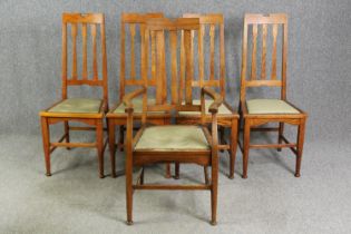 A set of Arts and Crafts oak dining chairs, early 20th century, including one carver.